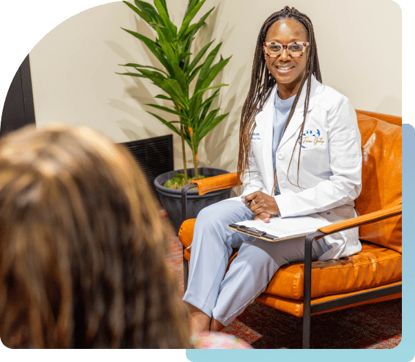 Doctor consulting patient in an office setting.